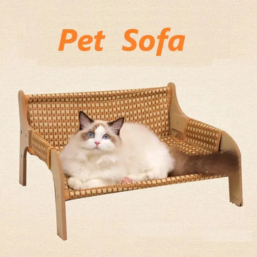 A fluffy white and brown cat lounges on the KittyNook Cat Co. Cat Summer Sofa Bed with